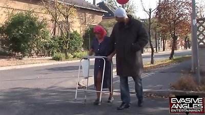 EVASIVE ANGLES This babushka, tights and glasses wearing grannie, is getting her thick older globes deep-throated by her multiracial caregiver